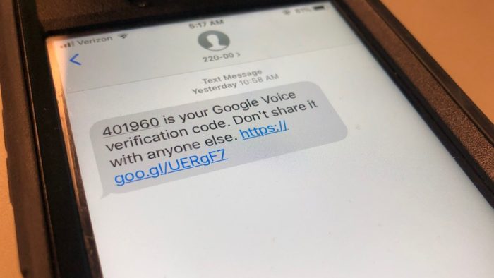 Google Voice verification scam text message on a smartphone